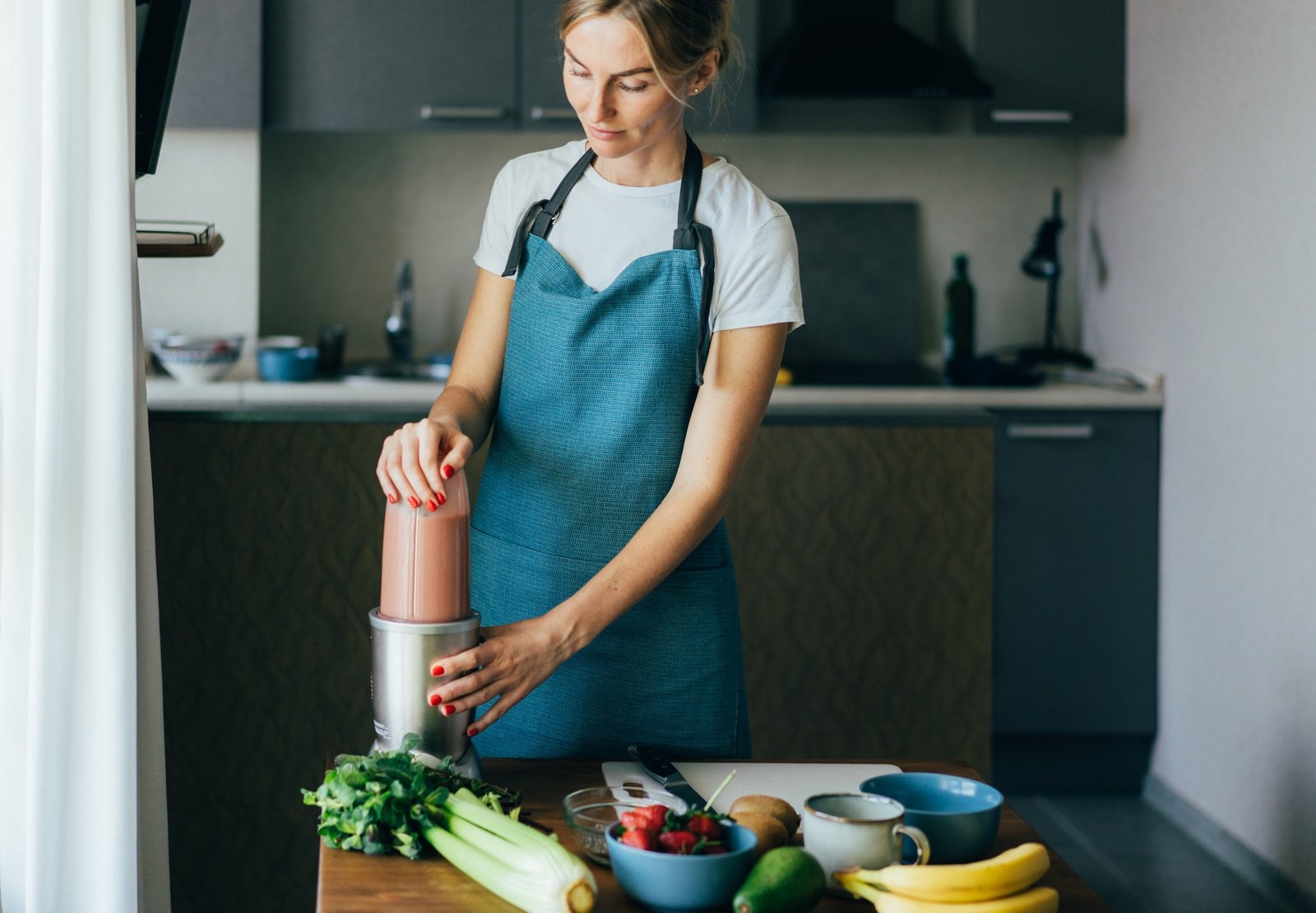 young-wellness-woman-preparing-a-nutritious-healthy-breakfast-in-her-kitchen-.jpg